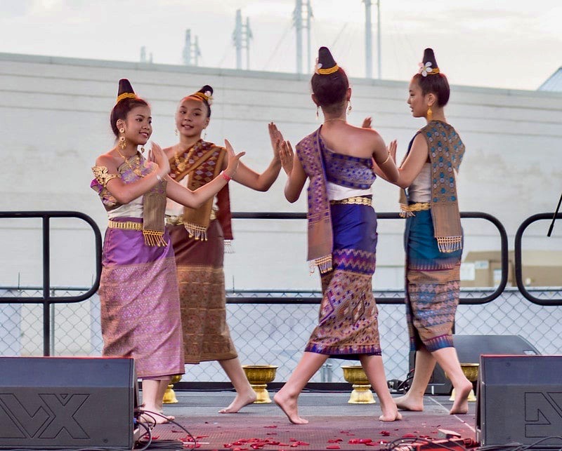 Four girls perform a dance on stage